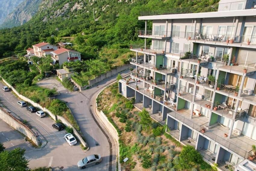 Two-bedroom apartment in Dobrota with sea view in a new building with swimming pool